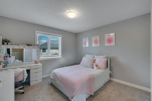 52 West Coach Court Sw, Calgary, AB - Indoor Photo Showing Bedroom