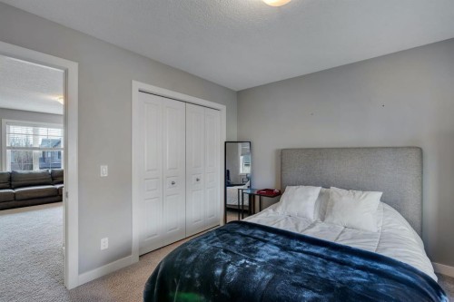 52 West Coach Court Sw, Calgary, AB - Indoor Photo Showing Bedroom