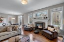 52 West Coach Court Sw, Calgary, AB  - Indoor Photo Showing Living Room With Fireplace 