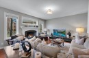 52 West Coach Court Sw, Calgary, AB  - Indoor Photo Showing Living Room With Fireplace 