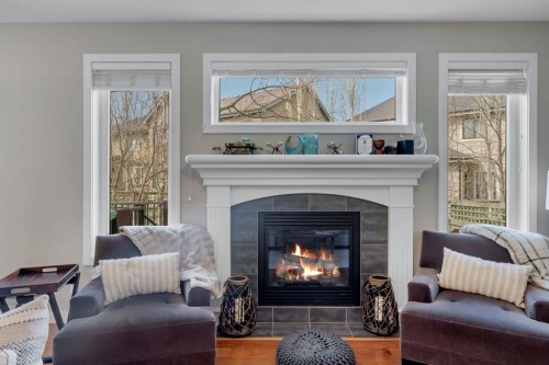 52 West Coach Court Sw, Calgary, AB - Indoor Photo Showing Living Room With Fireplace