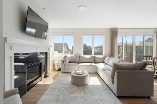 164 Precedence Hill, Cochrane, AB - Indoor Photo Showing Living Room With Fireplace