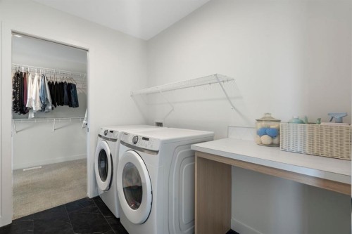 164 Precedence Hill, Cochrane, AB - Indoor Photo Showing Laundry Room