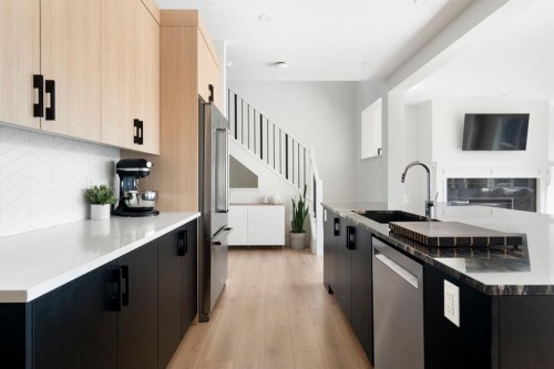 164 Precedence Hill, Cochrane, AB - Indoor Photo Showing Kitchen With Upgraded Kitchen