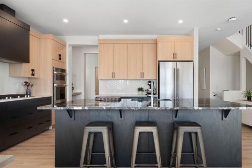 164 Precedence Hill, Cochrane, AB - Indoor Photo Showing Kitchen With Stainless Steel Kitchen With Upgraded Kitchen