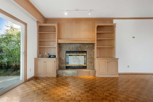 907 Shawnee Drive Sw, Calgary, AB - Indoor With Fireplace