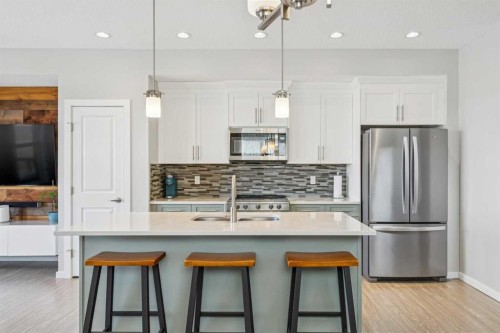 99 Heritage Heights, Cochrane, AB - Indoor Photo Showing Kitchen With Upgraded Kitchen
