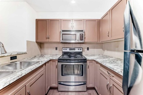 4305-115 Prestwick Villas Se, Calgary, AB - Indoor Photo Showing Kitchen With Stainless Steel Kitchen