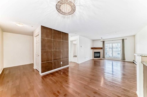 4305-115 Prestwick Villas Se, Calgary, AB - Indoor Photo Showing Living Room With Fireplace