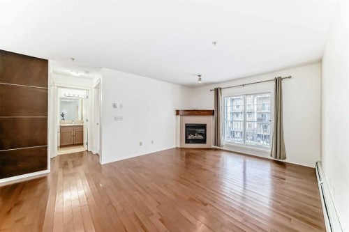 4305-115 Prestwick Villas Se, Calgary, AB - Indoor Photo Showing Living Room With Fireplace