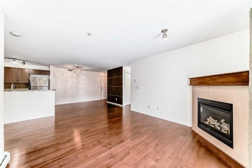 4305-115 Prestwick Villas Se, Calgary, AB - Indoor Photo Showing Living Room With Fireplace