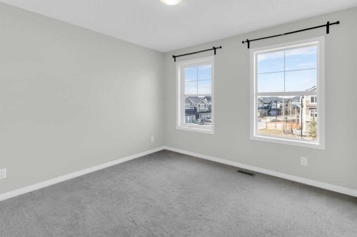 140 Sundown Road, Cochrane, AB - Indoor Photo Showing Other Room
