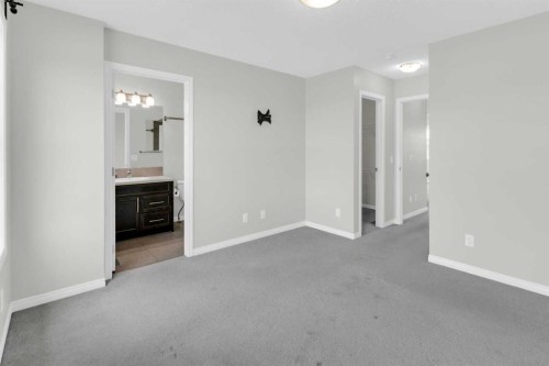 140 Sundown Road, Cochrane, AB - Indoor Photo Showing Other Room