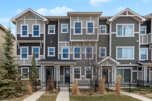 140 Sundown Road, Cochrane, AB - Outdoor With Facade