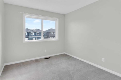 140 Sundown Road, Cochrane, AB - Indoor Photo Showing Other Room