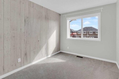140 Sundown Road, Cochrane, AB - Indoor Photo Showing Other Room