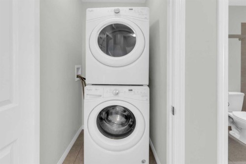 140 Sundown Road, Cochrane, AB - Indoor Photo Showing Laundry Room