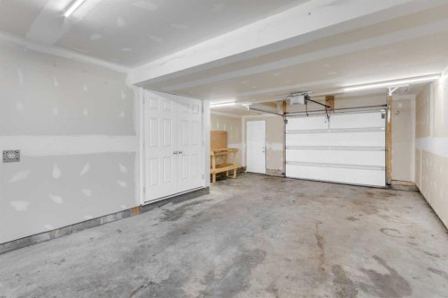 140 Sundown Road, Cochrane, AB - Indoor Photo Showing Garage
