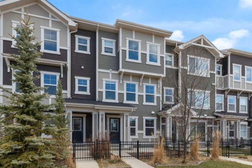 140 Sundown Road, Cochrane, AB - Outdoor With Facade