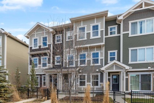 140 Sundown Road, Cochrane, AB - Outdoor With Facade