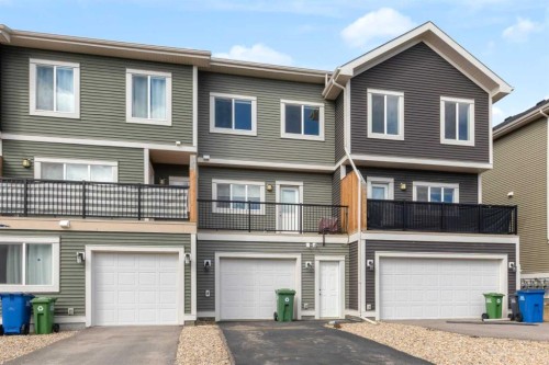 140 Sundown Road, Cochrane, AB - Outdoor With Facade