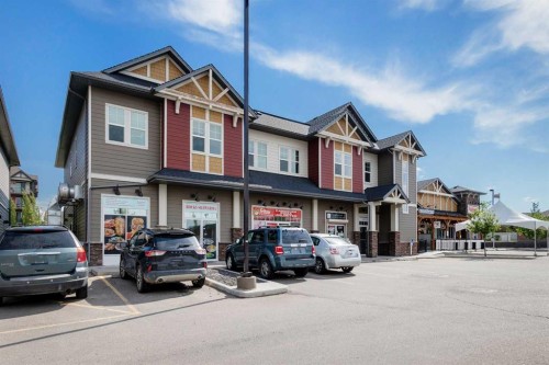 140 Sundown Road, Cochrane, AB - Outdoor With Facade