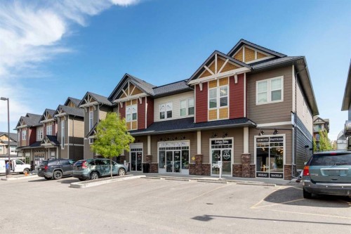 140 Sundown Road, Cochrane, AB - Outdoor With Facade