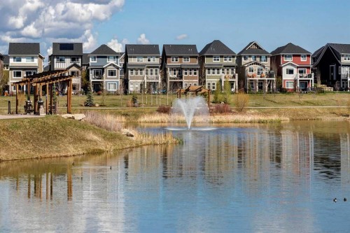 140 Sundown Road, Cochrane, AB - Outdoor With Body Of Water With Facade