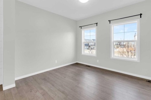 140 Sundown Road, Cochrane, AB - Indoor Photo Showing Other Room