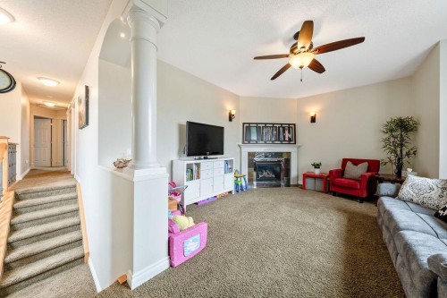 4 Cimarron Trail, Okotoks, AB - Indoor With Fireplace