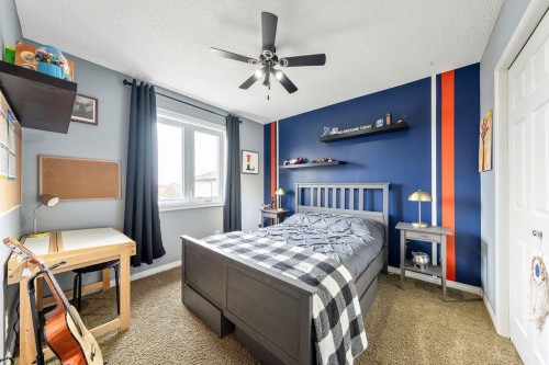 4 Cimarron Trail, Okotoks, AB - Indoor Photo Showing Bedroom