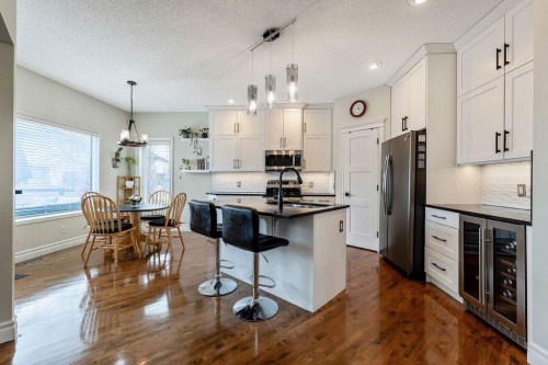 4 Cimarron Trail, Okotoks, AB - Indoor Photo Showing Kitchen With Stainless Steel Kitchen With Upgraded Kitchen