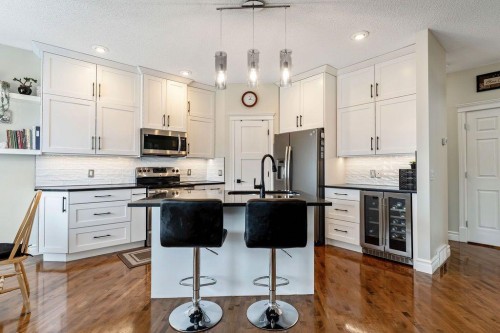 4 Cimarron Trail, Okotoks, AB - Indoor Photo Showing Kitchen With Stainless Steel Kitchen With Upgraded Kitchen