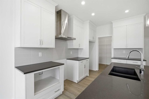 229 Dawson Wharf Road, Chestermere, AB - Indoor Photo Showing Kitchen With Double Sink With Upgraded Kitchen