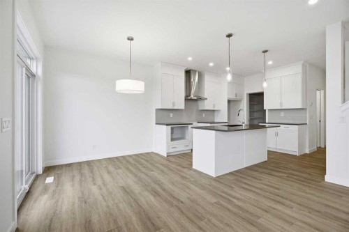 229 Dawson Wharf Road, Chestermere, AB - Indoor Photo Showing Kitchen With Upgraded Kitchen