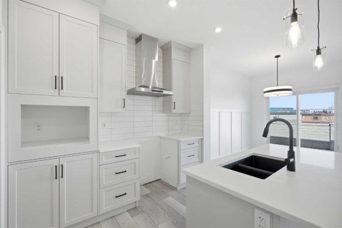 260 Dawson Wharf Crescent, Chestermere, AB - Indoor Photo Showing Kitchen With Double Sink With Upgraded Kitchen