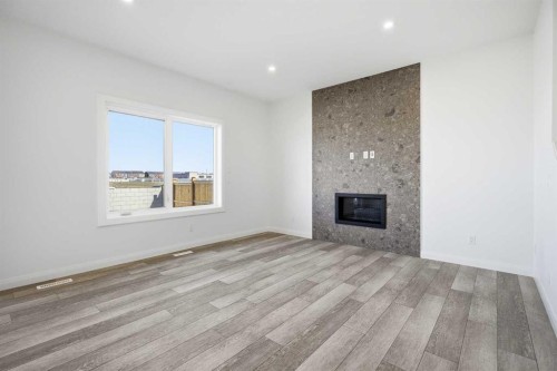 260 Dawson Wharf Crescent, Chestermere, AB - Indoor Photo Showing Other Room With Fireplace