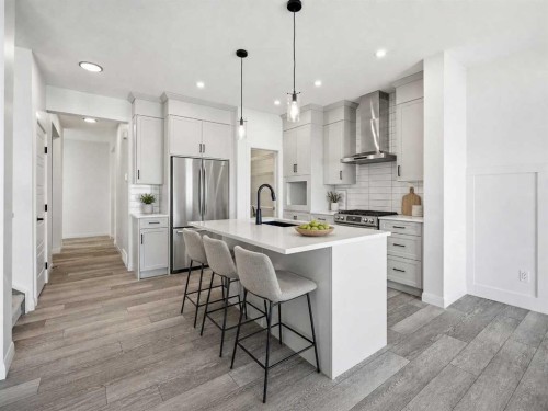 260 Dawson Wharf Crescent, Chestermere, AB - Indoor Photo Showing Kitchen With Stainless Steel Kitchen With Upgraded Kitchen