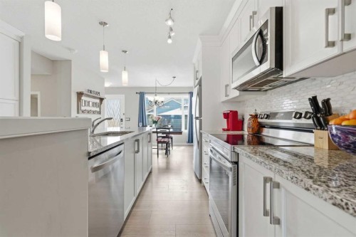 225 Fireside Drive, Cochrane, AB - Indoor Photo Showing Kitchen With Upgraded Kitchen