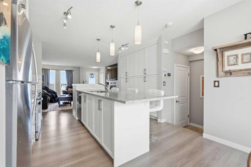 225 Fireside Drive, Cochrane, AB - Indoor Photo Showing Kitchen With Double Sink With Upgraded Kitchen