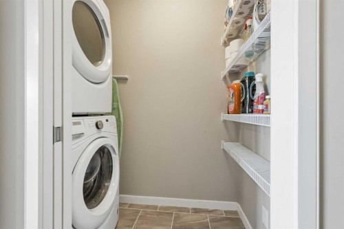 225 Fireside Drive, Cochrane, AB - Indoor Photo Showing Laundry Room