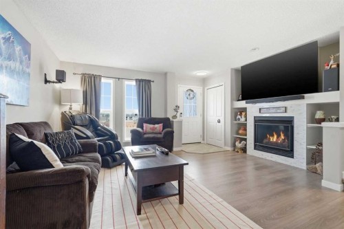 225 Fireside Drive, Cochrane, AB - Indoor Photo Showing Living Room With Fireplace