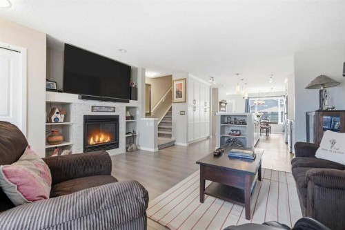 225 Fireside Drive, Cochrane, AB - Indoor Photo Showing Living Room With Fireplace
