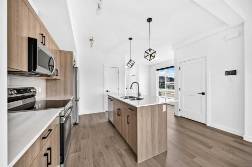3101-55 Lucas Way Nw, Calgary, AB - Indoor Photo Showing Kitchen With Double Sink With Upgraded Kitchen