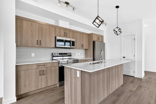 3101-55 Lucas Way Nw, Calgary, AB - Indoor Photo Showing Kitchen With Stainless Steel Kitchen With Upgraded Kitchen