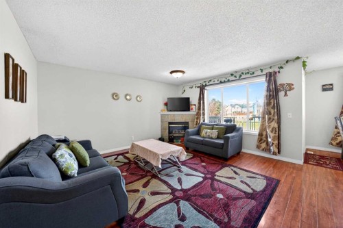 110 Martha'S Haven Green Ne, Calgary, AB - Indoor Photo Showing Living Room With Fireplace