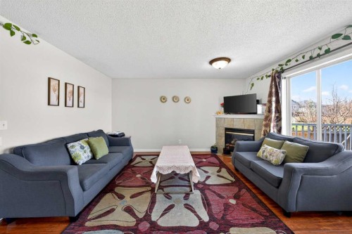 110 Martha'S Haven Green Ne, Calgary, AB - Indoor Photo Showing Living Room With Fireplace