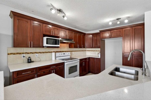 110 Martha'S Haven Green Ne, Calgary, AB - Indoor Photo Showing Kitchen With Double Sink
