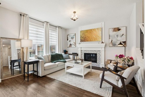36 Crestbrook Link Sw, Calgary, AB - Indoor Photo Showing Living Room With Fireplace