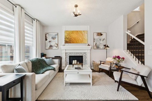 36 Crestbrook Link Sw, Calgary, AB - Indoor Photo Showing Living Room With Fireplace